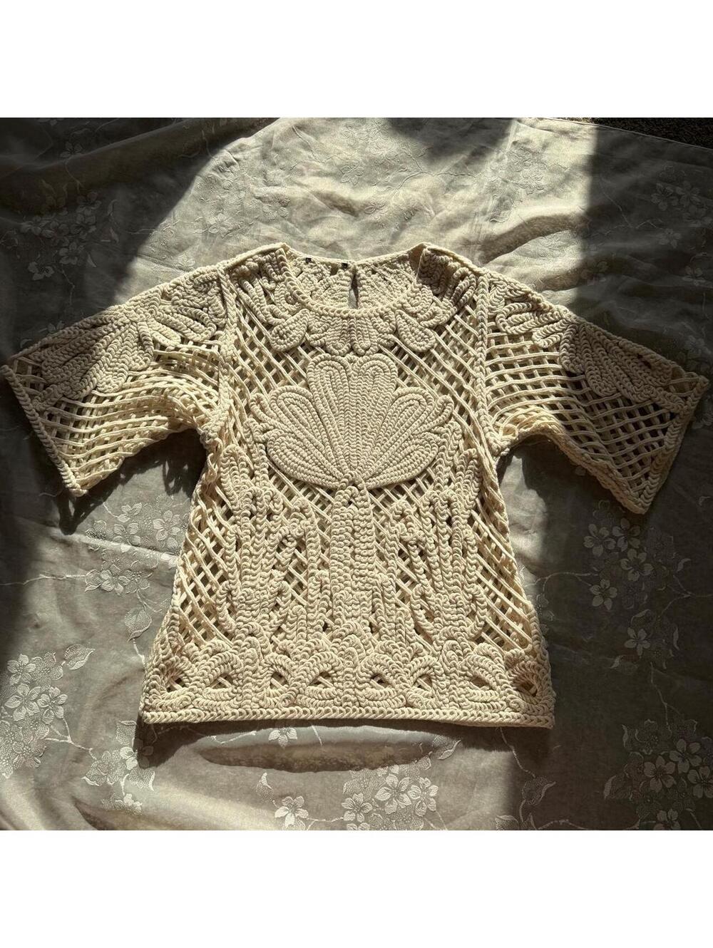 Super cute cream crochet top with floral and leaf motifs and wide sleeves